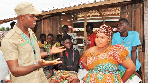 Mr Lomotey interacting with a pesticide seller at the Tongor-Dzemeni Market Mr Lomotey interacting with a pesticide seller at the Tongor-Dzemeni Market