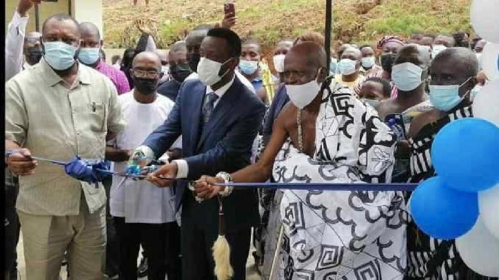 The newly built girls dormitory block for Nsein Senior High School. The Western Regional Minister, Mr Okyere Darko-Mensah being assisted by Dr. Matthew Opoku Prempeh (first left) and other officials to cut the tape to commission the dormitory block.
