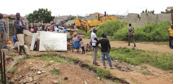 A demolition exercise being carried out at Frafraha by authorities of the Adentan Municipal Assembly