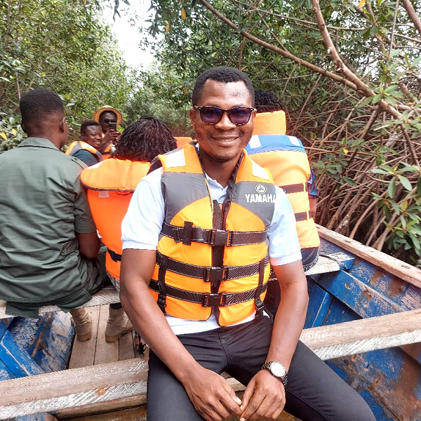 The writer, Zadok Kwame Gyesi, onboard a canoe to tour some mangrove sites in the Keta area