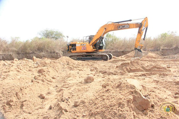 An excavator at the sand winning site at the Nawuni raw water intake area in the Kumbungu District