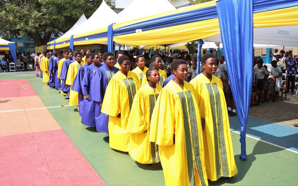 The school choir marching to the event grounds
