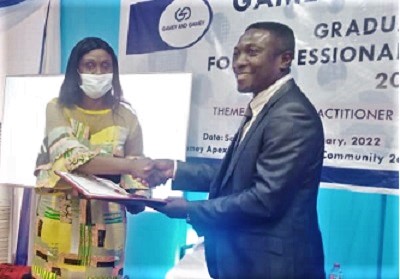 Dr Janet Ampadu Fofie (left), Chairperson of the Public Services Commission, presenting a certificate to Mr Charles Ntiamoah Amoako, Director Technical Services, Graphic Communications Group Limited and a member of the 23rd cohort of the ADR Institute