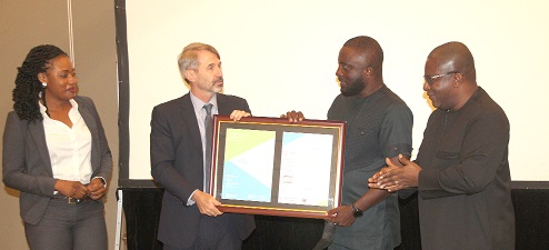 Mr Kyle F.Kelhofer (2nd from left), Country Manager of International Finance Corporation (IFC), presenting a certificate to Mr Samuel Winful (2nd from right), Chief Executive Officer of Crown Forest. With them are Ms Emidona Jehu-Appiah (left), Manager of Crown Forest and Mr Solomon Asamoah (right), Managing Director of Ghana Infrastructure Investment Fund (GIIF). Picture: ESTHER ADJEI