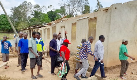 James Gyakye Quayson (second from right) being conducted round the community