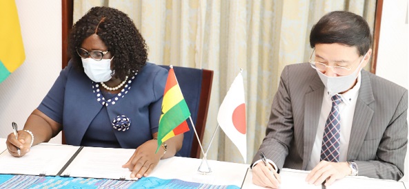 Christiana Akua Konadu (left) of the Jaman South Municipal Health Directorate and Mr Mochizuki Hisanobu (right), Japanese Ambassador to Ghana, signing the agreement in Accra.  Picture: AHIABOR GABRIEL 