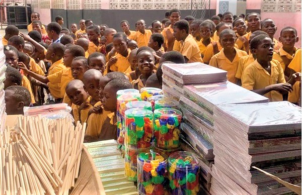 Pupils in a queue to receive the items.