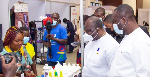 Ken Ofori-Atta (2nd from right), Minister of Finance; Dr John Kumah (right), a Deputy Minister of Finance, and others inspecting products of one of the youth enterprises