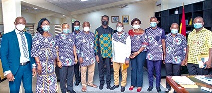 Dr Yaw Osei Adutwum (middle) with the leadership of GNAT after the meeting 