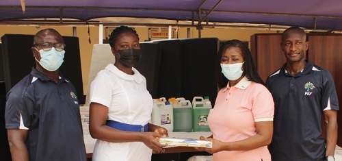 Ms Abena Adu-Gyamfi, Managing Partner of PKF, presenting the items to Ms Sabina Aniwaa Appiah, Senior Nursing Officer of the Accra Psychiatric Hospital. Picture: ERNEST KODZI