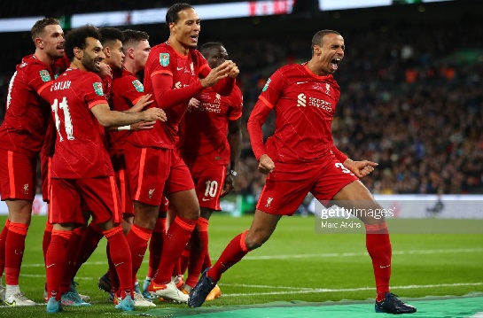 Liverpool players celebrating their League Cup victory over Chelsea