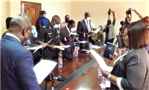 Mr Yeboah Dame (left), the Attorney-General and Minister of Justice, swearing in the new governing board of EOCO