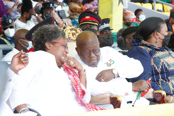 President Akufo-Addo interacting with Mia Amor Motley (left), the Prime Minister of Barbados, during the 65th Independence Day celebration in Cape Coast. Picture: SAMUEL TEI ADANO