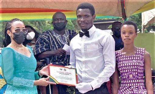 Dr Zanetor Agyeman-Rawlings (left) presenting a certificate to the Ringway Estate Basic School for emerging winners in the march past at the basic school level