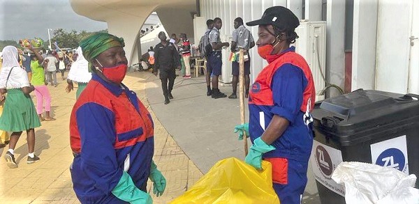  Staff of Zoomlion carting away waste generated at the Cape Coast Stadium