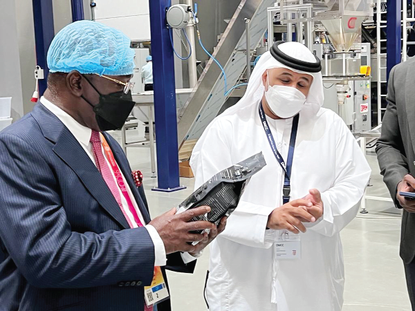 Dr Owusu Afriyie Akoto (left), Minister of Food and Agriculture, examining one of the packages of coffee at the Dubai Agric Commodities in Dubai, while Saeed Al Suwaidi, Director of Dubai Agric Commodities, looks on