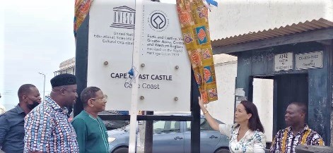 Anne Sophie Avé (2nd from right), unveiling a signage at the Cape Coast Castle. With her is Diallo Abdourahaman (3rd from left) and Kingsley Ntiamoah (2nd from left)
