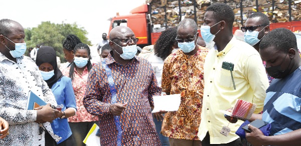 Dr Kwaku Afriyie (middle) Minister of Environment,Science, Technology and Innovation (MESTI), interacting with some executive members of Kpone Plastic Waste Collectors Association during his tour. Pictures: EBOW HANSON
