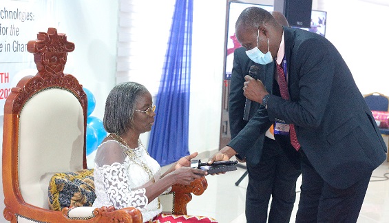  Dr John Kwaku Amaglo (right) handing  over the symbolic mantle of office to Mrs Rosemargaret Esubonteng, the new President