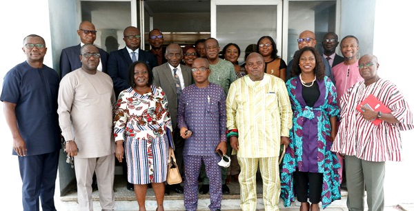 Yaw Boadu-Ayeboafoh (middle), Chairman, NMC, George Sarpong (2nd from left), Executive Secretary, NMC, Ransford Tetteh (3rd from right), Chairman, GNA Board, Albert Kofi Owusu (left), GM, GNA and other members of board and stakeholders after the swearing in