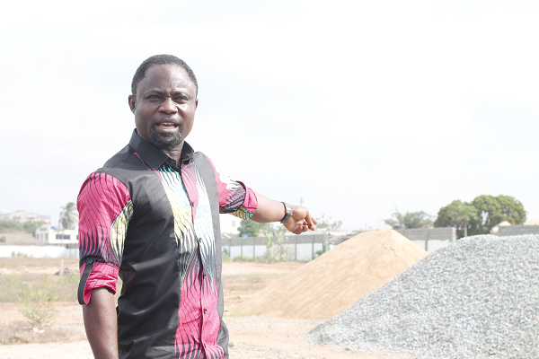 Mr Kwabena Mintah Akandoh, Ranking Member on Health and MP for Juaboso  in the Western Region, making some remarks about the heaps of sand and gravels on the La General Hospital construction site. Picture: Maxwell Ocloo