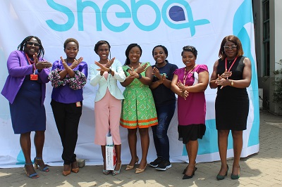 The Mirror team and representatives from Yemaachi Biotechnology striking the IWD #BreakTheBias pose