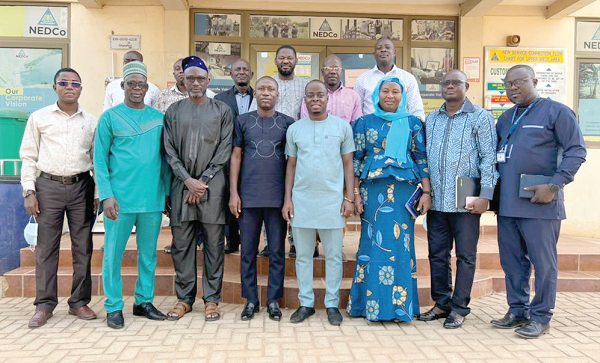 Dr Ismail Ackah (4th from right) and the officials of NEDCo after the meeting