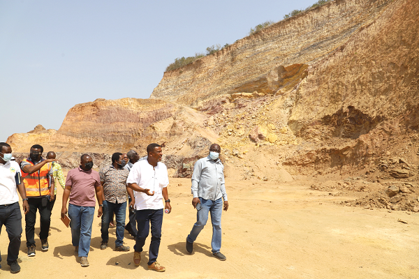  Ransford Sekyi (4th from left), acting Deputy Executive Director in charge of Operations at the Environmental Protection Agency (EPA), Michael Ali Sandow (right), acting Director of Mining Department of the EPA, and other officials inspecting the damages caused by the sand winners at the Weija Ridge in Accra. Picture: GABRIEL AHIABOR
