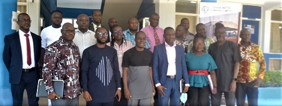Dr Ishmael Ackah  (3rd from left — front row), Executive Secretary of the PURC, with some staff of the Upper East Region office of the GWCL after the meeting