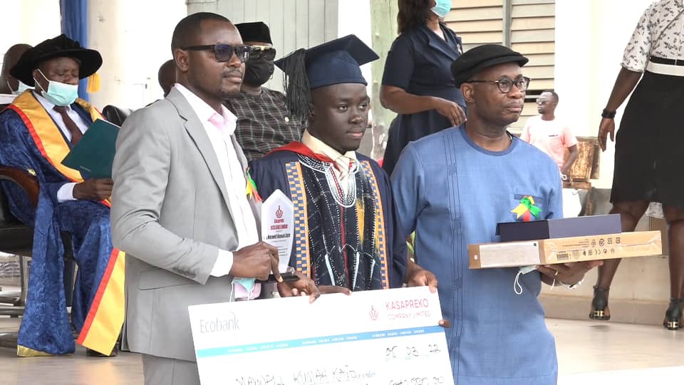Master Kato Maxwell Kumah (middle) with officials of Kasapreko after he was presented with his award 