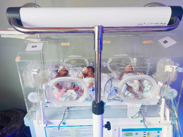 The triplets enjoying the warmth of an incubator donated by a partner