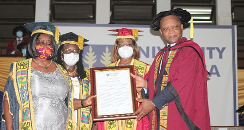 Mary Chinery-Hesse (left), Chancellor of the University of Ghana (UG), presenting a citation to Dr John Nkengasong (right), Director, Africa Centres for Disease Control and Prevention. Assisting are Justice Sophia Akuffo (2nd from right), Chairperson of the UG Governing Council, and Prof. Nana Aba Appiah Amfo (2nd from left), Vice-Chancellor, UG. Picture: MAXWELL OCLOO