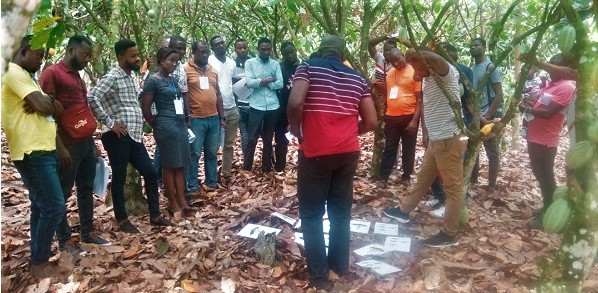 A facilitator with the extension agents at the training programme
