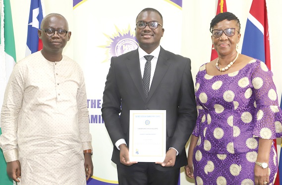 Asante Kwame Brako (middle), a former student of the Presbyterian Senior High School, Legon, with Professor Kwasi Opoku-Amankwa (left), Director-General, GES, and Wendy Anyone Addy-Lamptey (right), Head of National Office, WAEC. Picture: GABRIEL AHIABOR