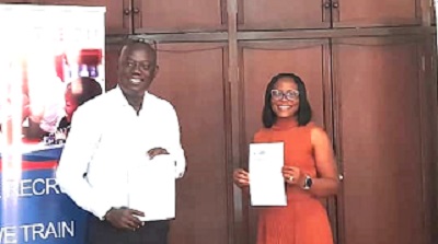 Matthew Darkwa, Director of Operations, AmaliTech Ghana, and Sally Ofori Yeboah, National Director, CAMFED Ghana, after the signing the MoU
