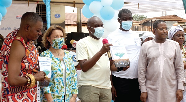 Donnan Tay (3rd from left), a representative of the Minister, Sanitation and Water Resources, launching the groundwater book. With him are Okukrubour Nene Tei Kwesi Agyemang (left),   Annie Claire (2nd from left), United Nation’s Resident Coordinator to Ghana;  Fred Offei  (2nd from right), District Chief Executive, Shai Osudoku, and Abdourahamane Diallo (right), Head, UNESCO-Accra. Picture: ERNEST KODZI