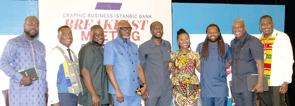  Dr Joseph Obeng (4th from left), the GUTA president, with Ato Afful (2nd from right), MD for GCGL, Franklin Sowah (right), the Director Marketing, GCGL, Mawuko Afadzinu (2nd from left), the Brands and Marketing Manager, Stanbic Bank, and some participants after the breakfast meeting 