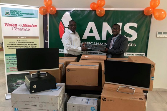 Mr Joseph Abu Baka (left), Operation Manager of the company, presenting the computers to Prof. Anthony Simons (right), the Pro-Vice Chancellor of UMaT