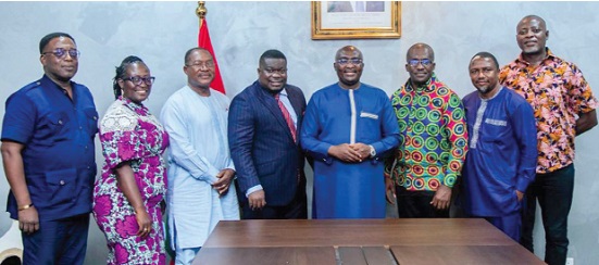 Vice-President Dr Mahamudu Bawumia (5th from left) with the board members of Ghana Post