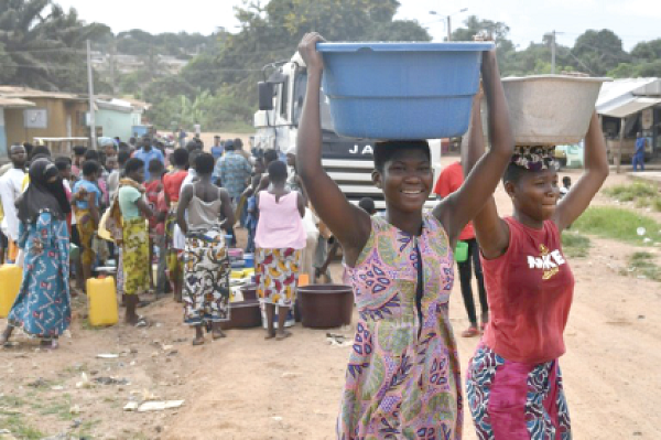 A tanker service delivering water. Water supply shortages compel nurses to cross the border to Burkina Faso in search of it.