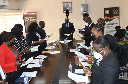 Mr Godfred Yeboah Dame (arrowed), the A-G and Minister of Justice, administering the oath to the new board members 