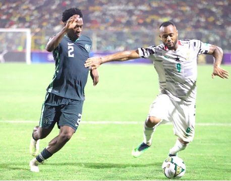 Jordan Ayew (right) controls the ball with Ola Oluwa Auna close on his heels in their match at the Baba Yara Stadium in Kumasi.