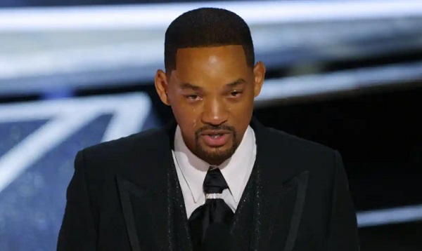 Will Smith on stage accepting his best actor award. Photograph: Brian Snyder/Reuters