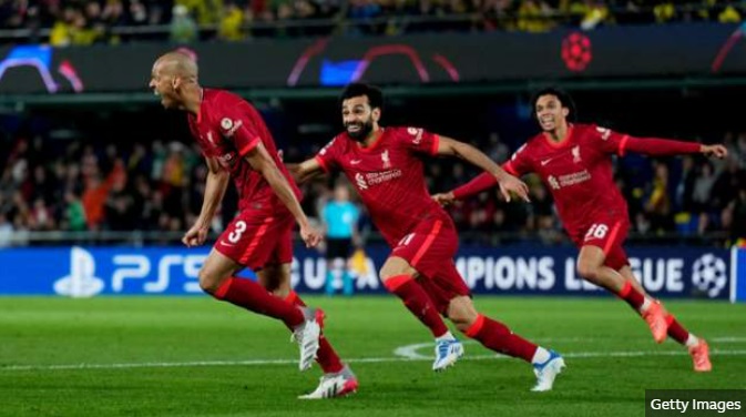 Liverpool players take off in jubilation after a goal