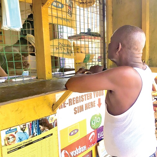A patron at a MoMo merchant shop