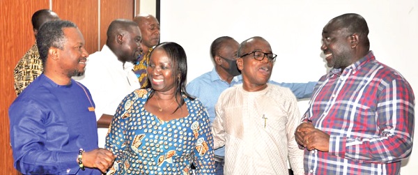 Yaw Boadu-Ayeboafo (2nd from right) interacting with George Sarpong (right), Executive Secretary, and some members of the NMC after the orientation programme in Ho