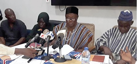 David Apasera (2nd from right), leader of the PNC, addressing the media at the press conference