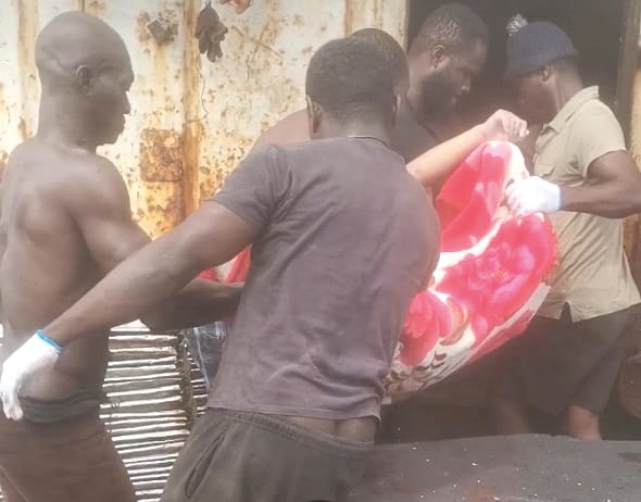  One of the bodies being conveyed into the boat