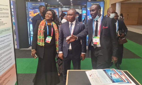  Ahmed Nantogmah (right), Director, External Relations and Communications at the Ghana Chamber of Mines, explaining a point to George Mireku Duker, a DeputyMinister of Lands and Natural Resources, at the Mining Indaba Confab in South Africa. With them is Barbara Oteng-Gyasi (left), Board chairperson, Minerals Commission