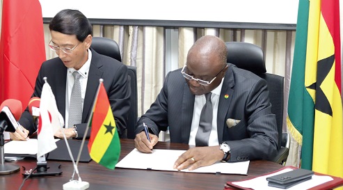 Hisanobu Mochizuki (left), Japanese Ambassador to Ghana, and  Kwaku Ampratwum-Sarpong, Deputy Minister, Foreign Affairs and Regional Integration, signing the agreement. Picture: ERNEST KODZI